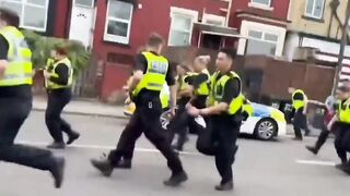 When British police fled chased by angry immigrants. Memorable scene.