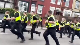 When British police fled chased by angry immigrants. Memorable scene.