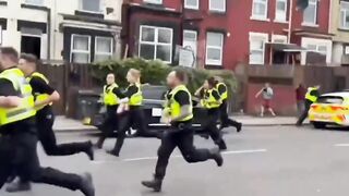 When British police fled chased by angry immigrants. Memorable scene.