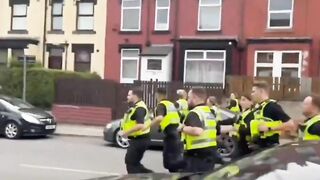When British police fled chased by angry immigrants. Memorable scene.