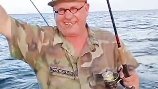 Fisherman shows Off his "Unusual "Catch of the Day"