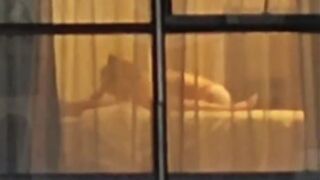 Chinese Man recording gets Excited from Couple who didn't Close the Curtains