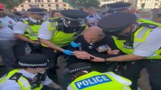 UK Police Arresting Crippled War Veteran for Holding "Offensive" Sign.