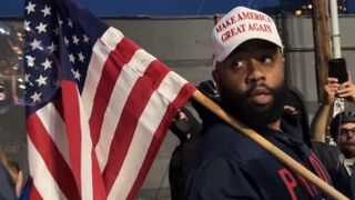 Black man comes to the ICE Facility with a MAGA Hat and America Flag