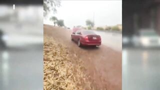 Man rescues stranded drivers in floodwaters