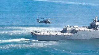 The Navy Seals perform a fast rope Demonstration