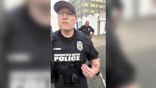Man trying to file a complaint against a business confronts a police officer