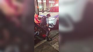 Man blocking Sydney tram gets into a fight with police officers