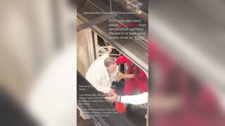 Woman grew tired of a man in a wig holding up the train