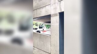 Man in a U-Haul van damaging the roof after driving into a parking garage