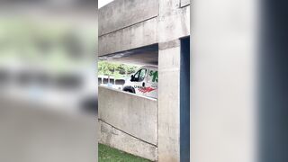 Man in a U-Haul van damaging the roof after driving into a parking garage
