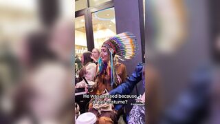 A man dressed as a woman attacks a woman dressed as a native American