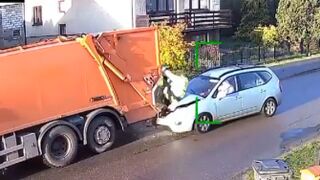 Car hit the back of a parked garbage truck injuring a a sanitation worker