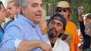 Man holding "You proved Charlie right" sign ATTACKED and pushed to ground by anti-ICE