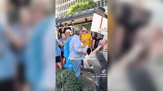 Man holding "You proved Charlie right" sign ATTACKED and pushed to ground by anti-ICE