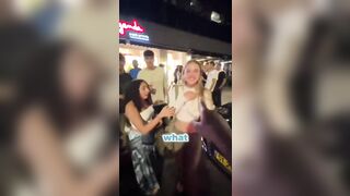 He extends his hand to four girls to see who will give him their hand and this happens.