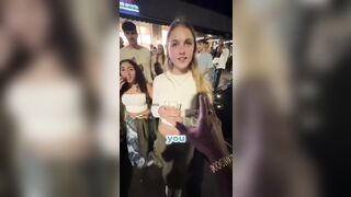 He extends his hand to four girls to see who will give him their hand and this happens.