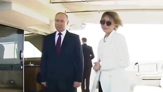 Classic: Putin gesturing a female host not to speak while the national anthem is being played. Meanwhile the USA is collapsing