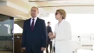 Classic: Putin gesturing a female host not to speak while the national anthem is being played. Meanwhile the USA is collapsing