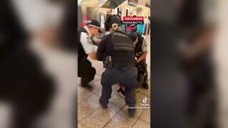 The guy has a knife, and the female police officer doesn't pull out her weapon.