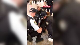 The guy has a knife, and the female police officer doesn't pull out her weapon.