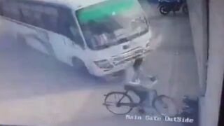 Out-of-control bus misses parked cyclist by just inches as it crashes into building