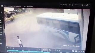 Out-of-control bus misses parked cyclist by just inches as it crashes into building