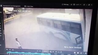 Out-of-control bus misses parked cyclist by just inches as it crashes into building