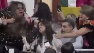 group of female Mexican lawmakers fight pull hair during Mexico city congress session