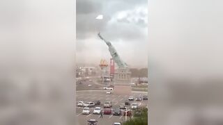 Strong winds knock over a replica of the Statue of Liberty in Guaíba, Brazil